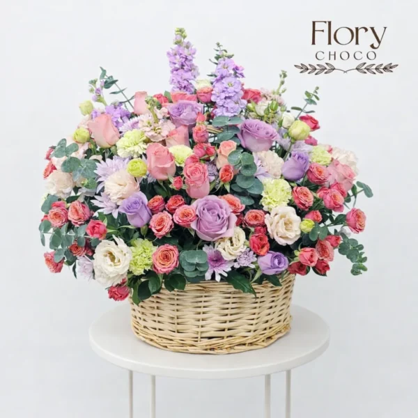 Colorful fresh mixed roses basket for elegant gifting and special celebrations from Florchoco online flower shop in Qatar